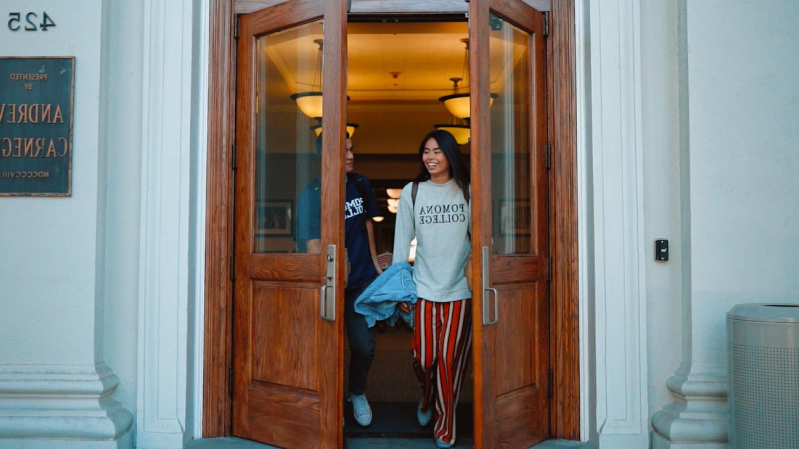 students walking through a doorway